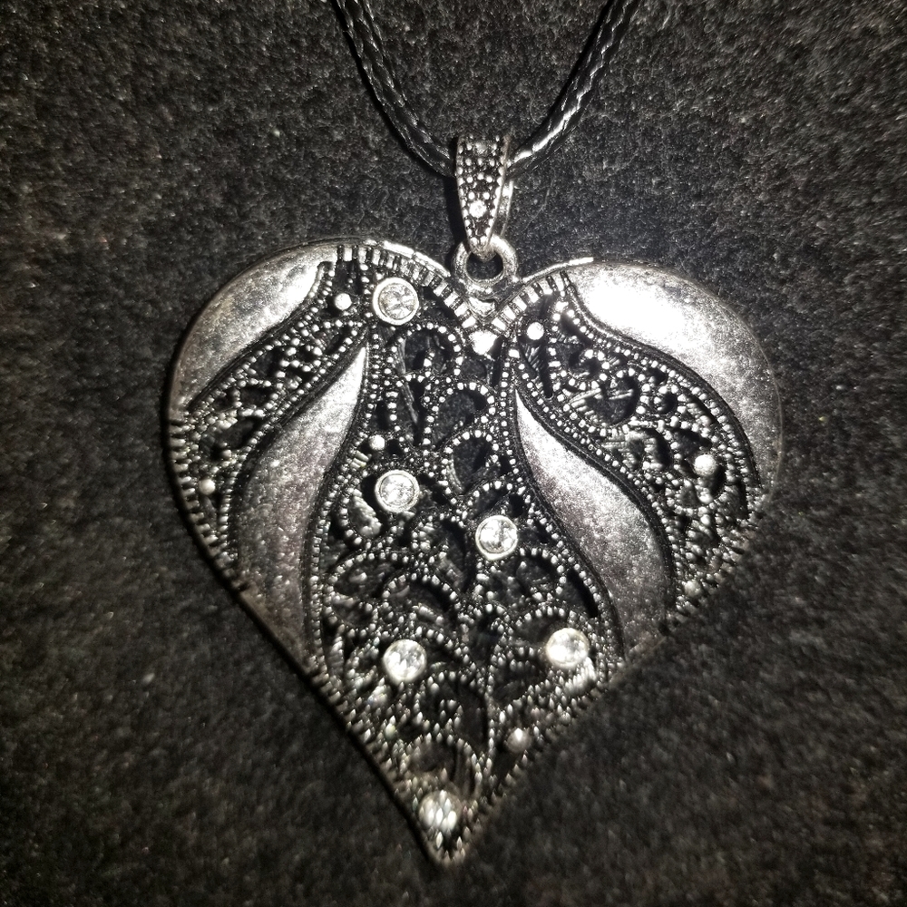 Beautiful long rope necklace with heart pendant.